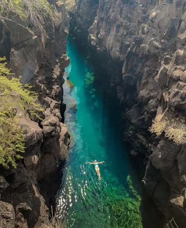 Galapagos Islands ocean between rocks | Andean Travel Experience Galapagos Islands ocean between rocks | Andean Travel Experience