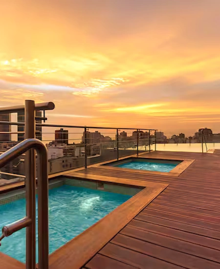 Stunning Sunset at the Rooftop Pool of Hilton Miraflores | Andean Travel Experience Rooftop pool at the Hilton Miraflores, featuring stunning sunset views over Lima | Andean Travel Experience