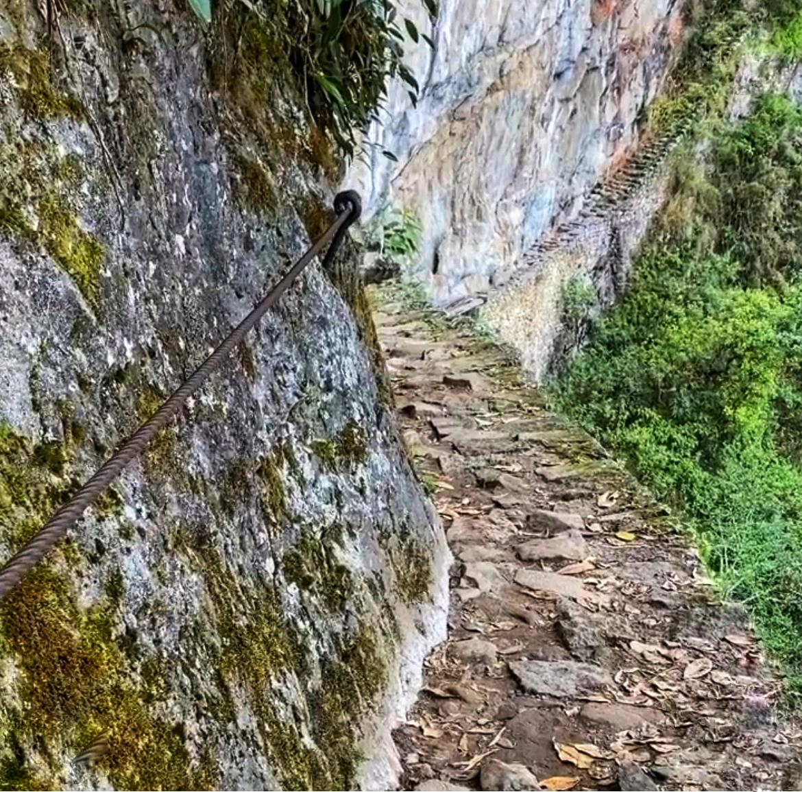 Inca Bridge at Machu Picchu | Andean Travel Experience Inca Bridge at Machu Picchu, Peru – Ancient stone bridge built over a steep ravine | Andean Travel Experience