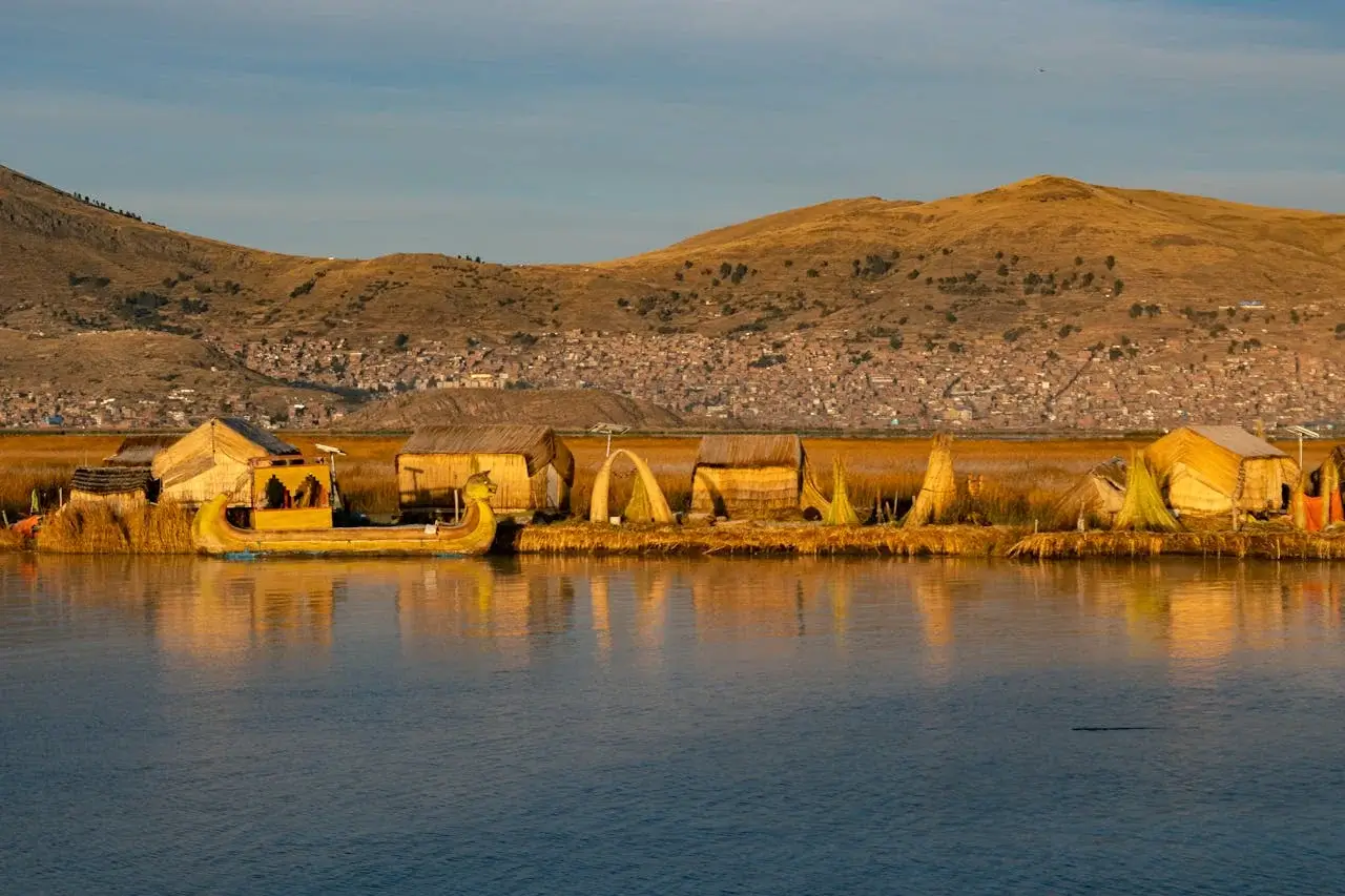 Traditional totora reed houses on the Uros Floating Islands, Lake Titicaca | Andean Travel Experience Traditional totora reed houses on the Uros Floating Islands, Lake Titicaca | Andean Travel Experience
