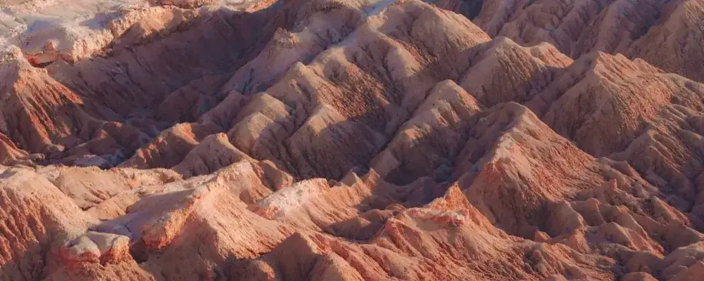 Aerial view of majestic Andean mountains under a clear sky | Andean Travel Experience Aerial view of majestic Andean mountains under a clear sky | Andean Travel Experience