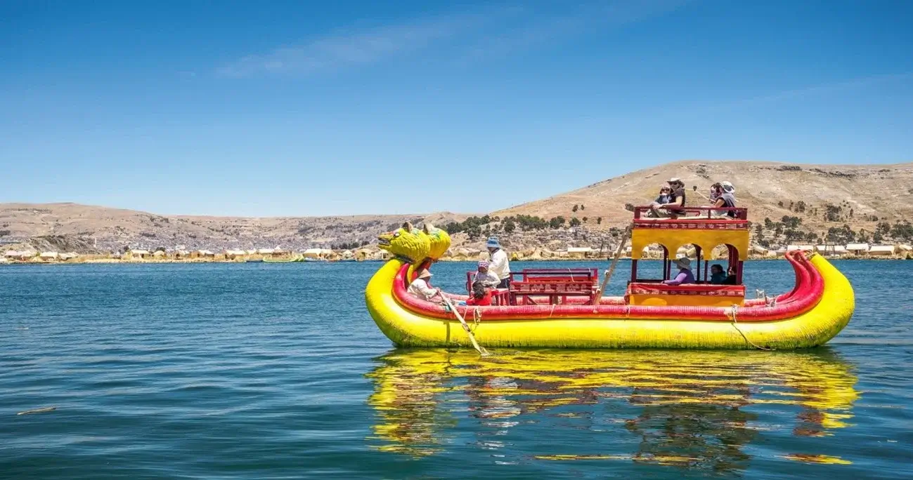 Traditional totora reed boat floating on Lake Titicaca, Peru | Andean Travel Experience Traditional totora reed boat floating on Lake Titicaca, Peru" | Andean Travel Experience