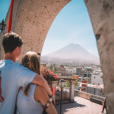 Tourists at Yanahuara Lookout with View of Misti Volcano | Andean Travel Experience Tourists viewing the Misti Volcano from the Yanahuara Lookout in Arequipa, Peru | Andean Travel Experience
